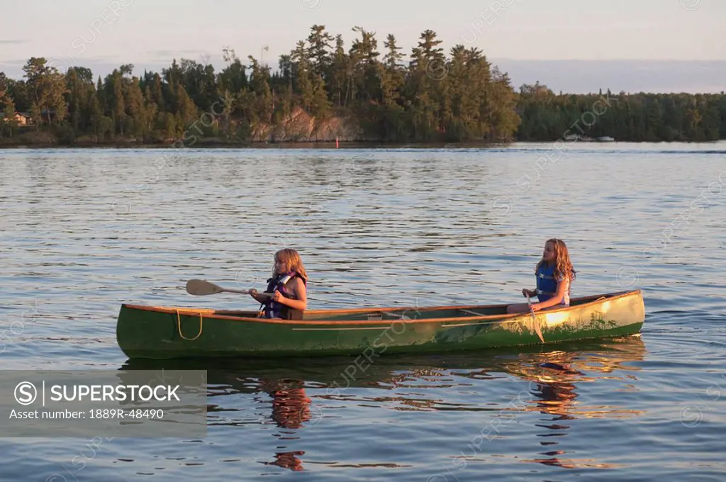 Two girls canoeing