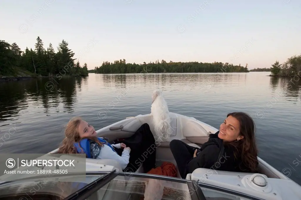 Mother and daughter on a boat, Lake of the Woods, Ontario, Canada