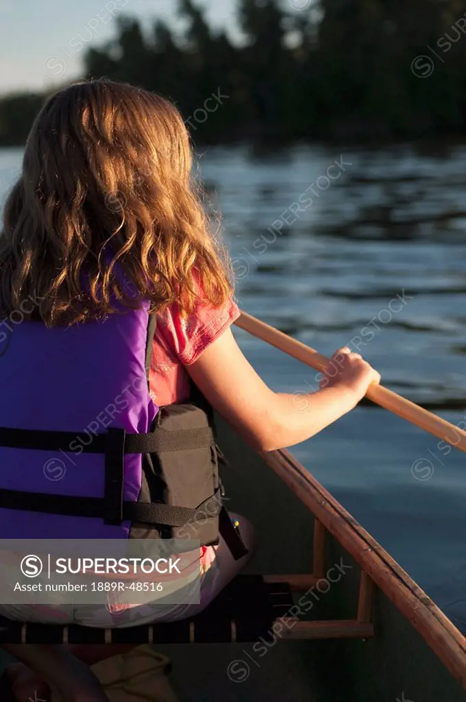 Girl in a canoe, Lake of the Woods, Ontario, Canada