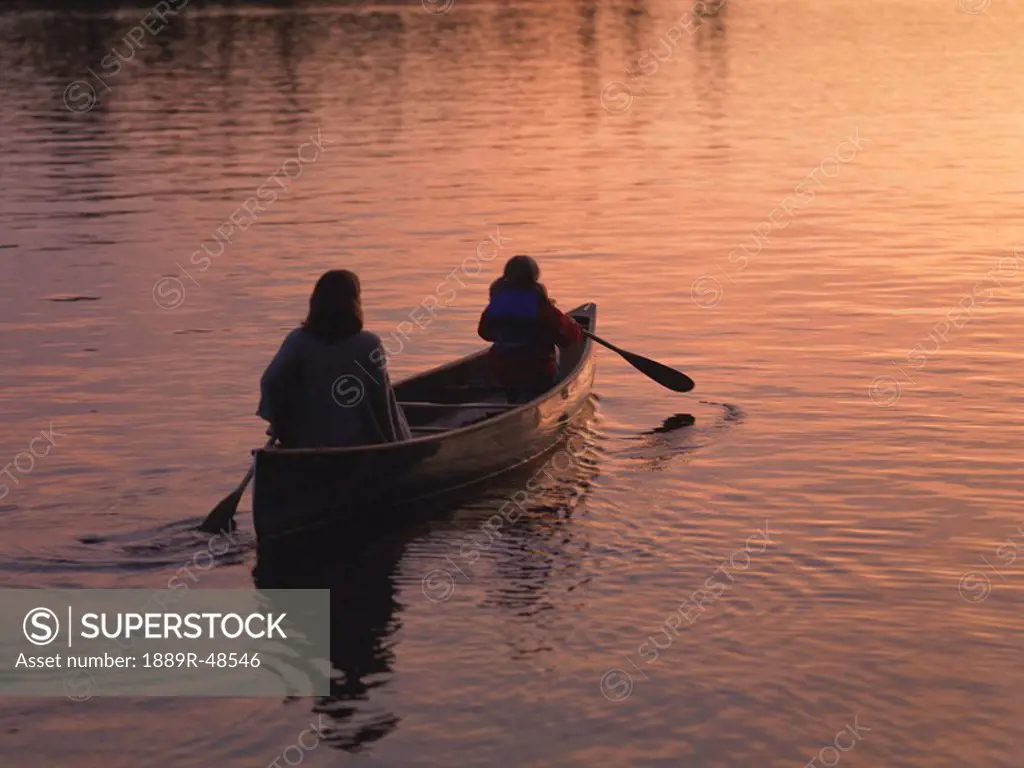 Two people in a canoe, Lake of the Woods, Ontario, Canada