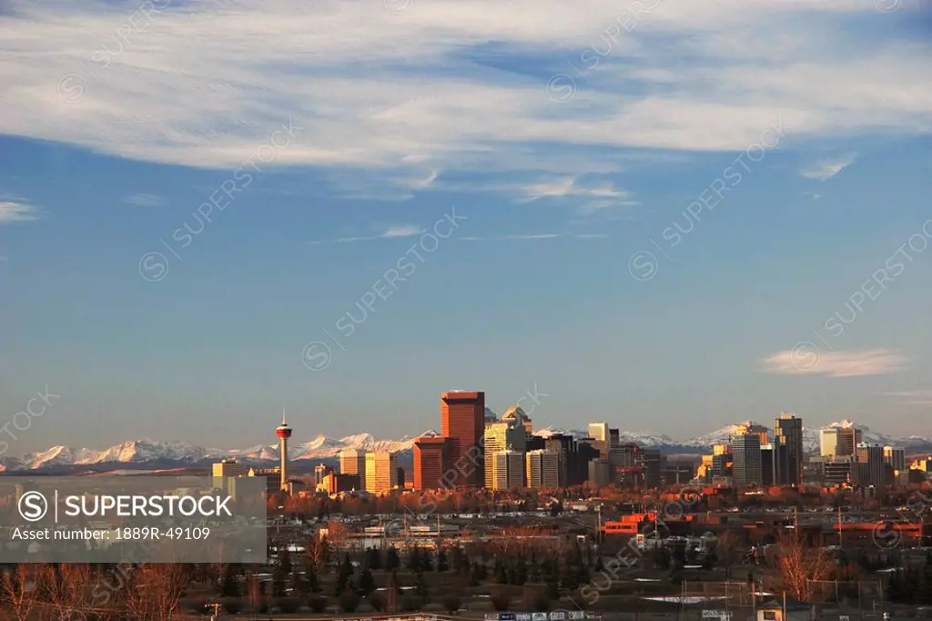 City skyline against mountain backdrop, Calgary, Alberta, Canada