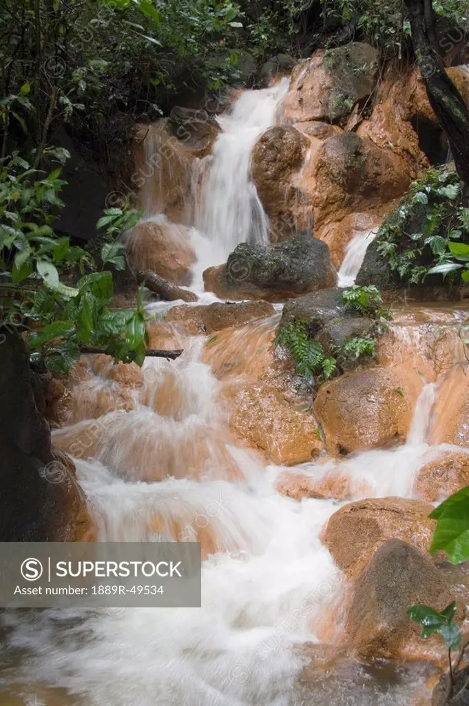 costa rica mountain stream and waterfalls