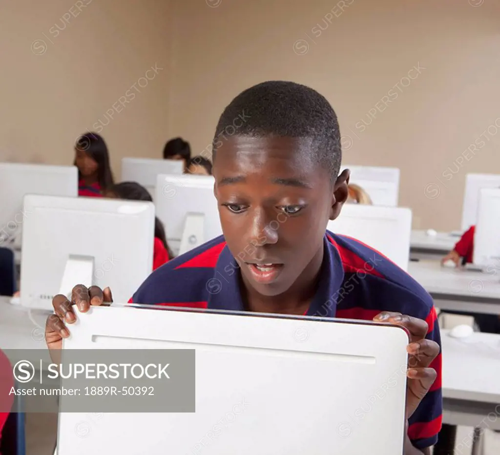 student looking surprised while in computer class