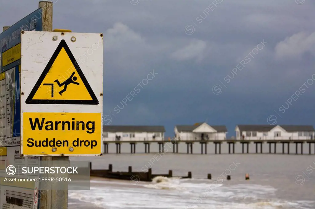southwold, suffolk, england, sign of warning and a sudden drop posted on the beach