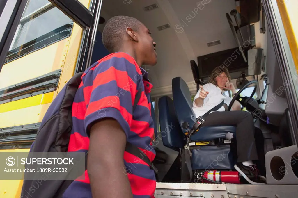 student greeting the school bus driver