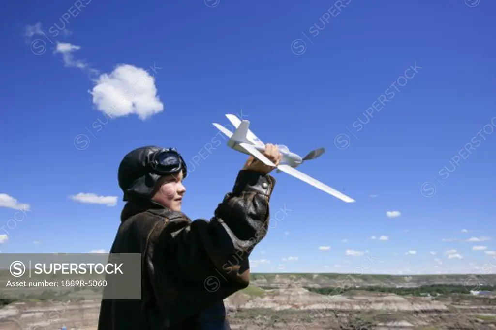 Boy playing with airplane