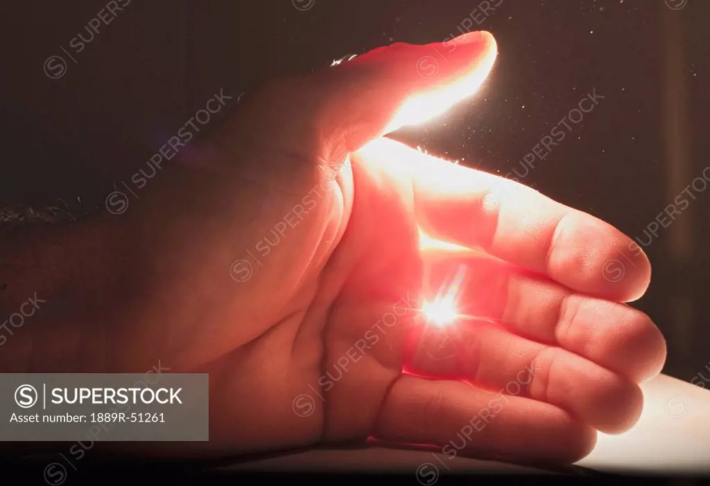 light shining onto a hand