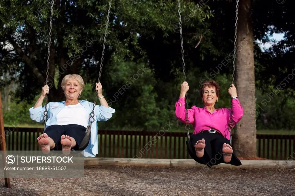 fort lauderdale, florida, united states of america, two women on the swings