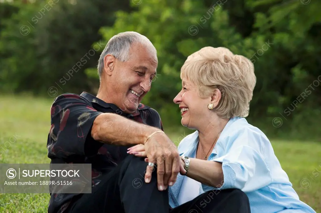 fort lauderdale, florida, united states of america, a couple sitting together on the grass
