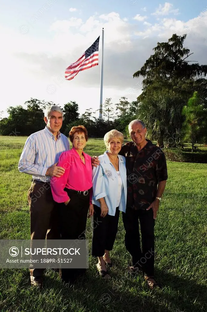 fort lauderdale, florida, united states of america, two couples with the america flag flying overhead