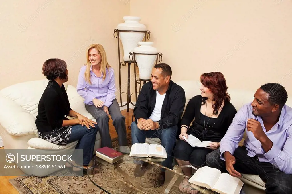 a group of adults in a home bible study