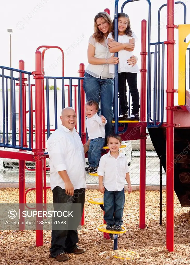 portrait of a family at the playground