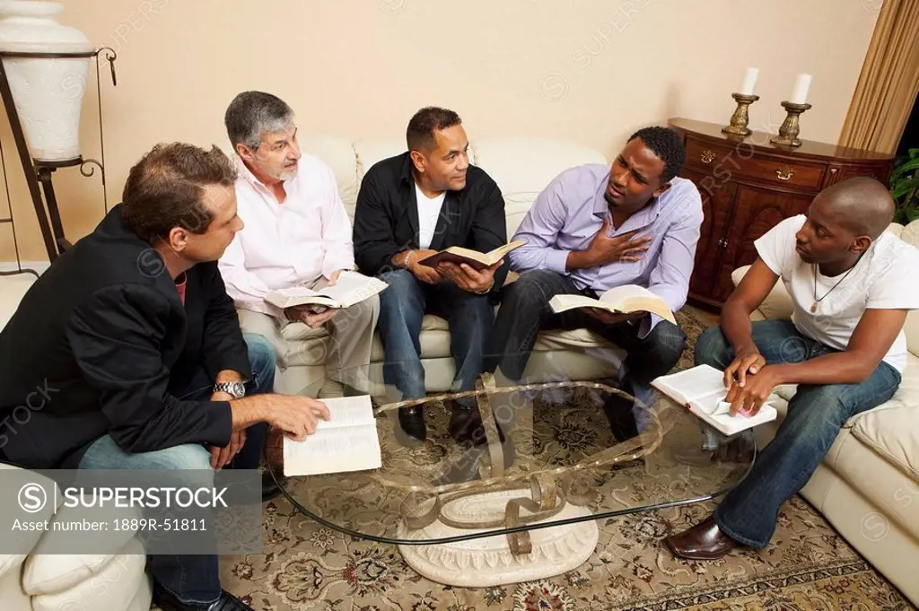 a group of men having a bible study