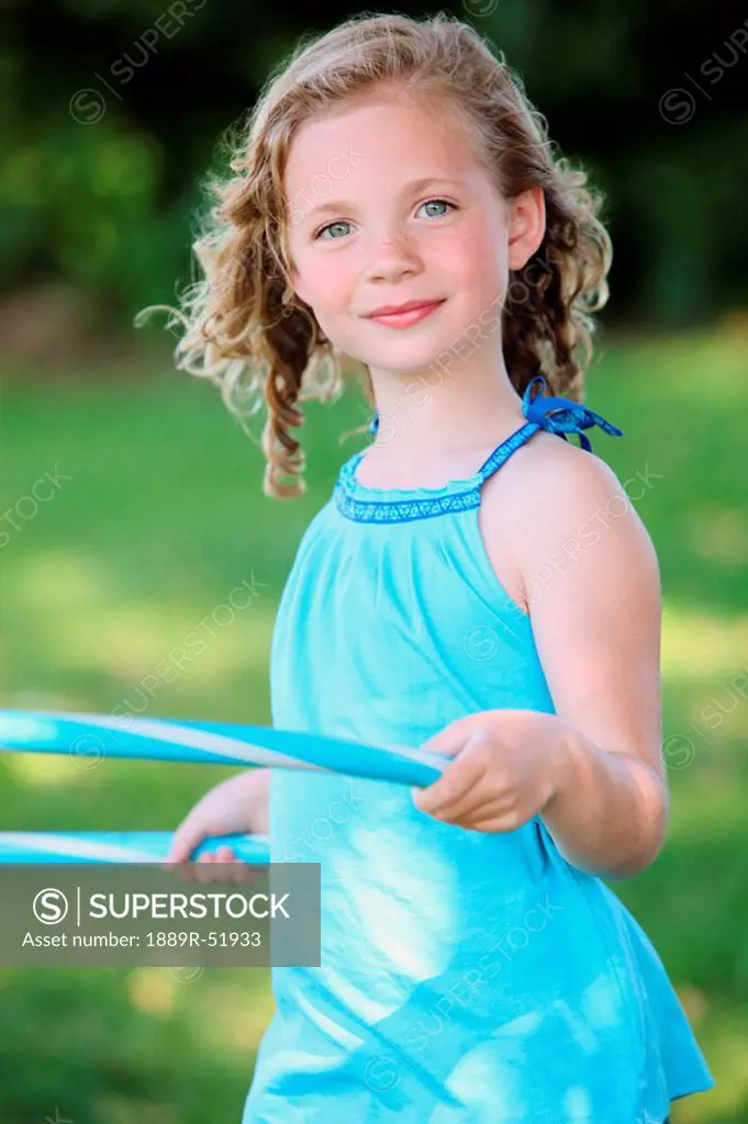 a girl with a hula hoop