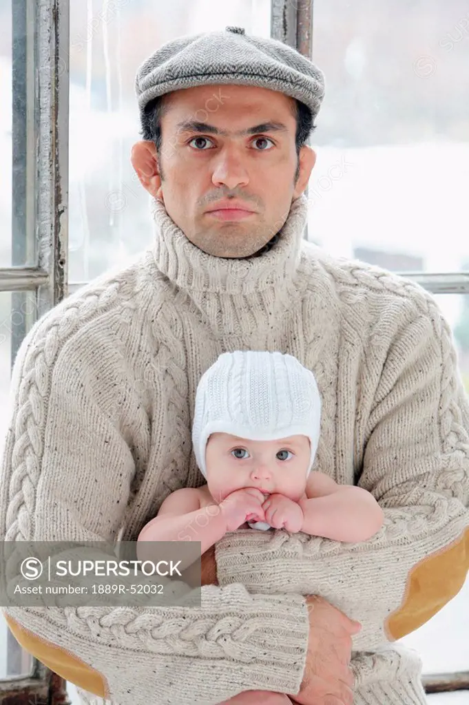a man holding an infant