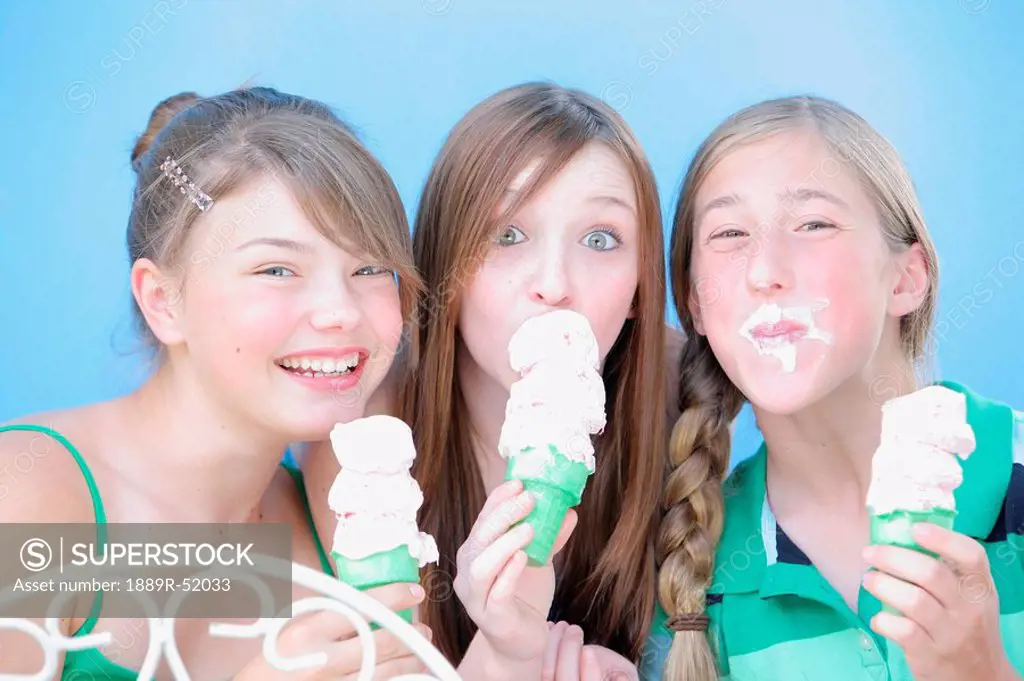 three girls eating ice cream cones