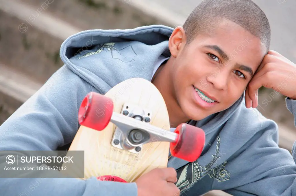 a boy with a skateboard
