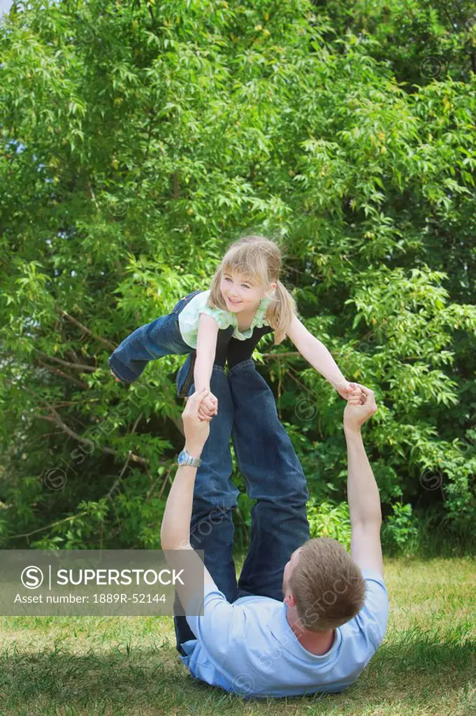 a father playing with his daughter