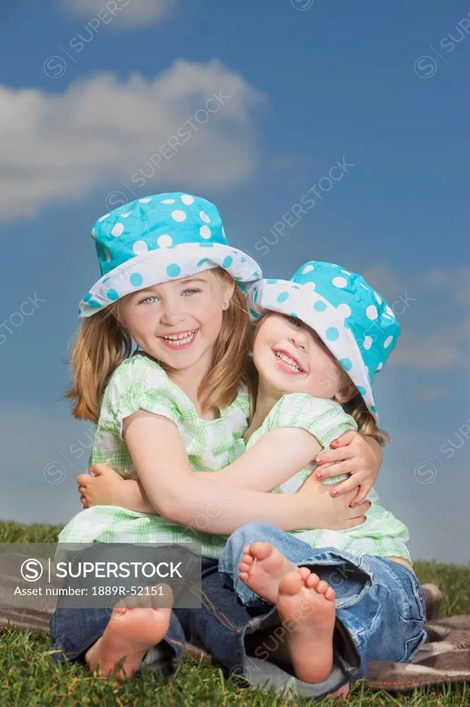 two young girls hugging
