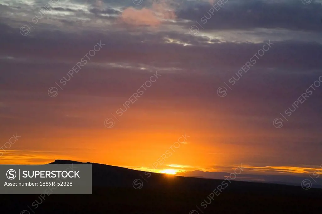 south yorkshire, england, a sun setting over the hills in peak district national park