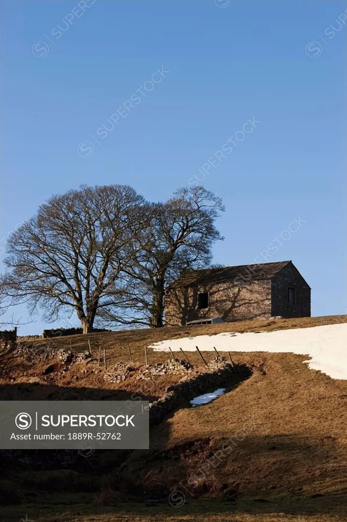 durham dales, durham county, england, a building against a blue sky with traces of snow