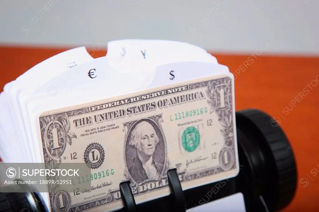 an american dollar bill in a rolodex
