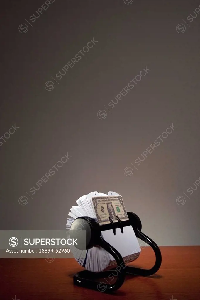 an american dollar bill in a rolodex