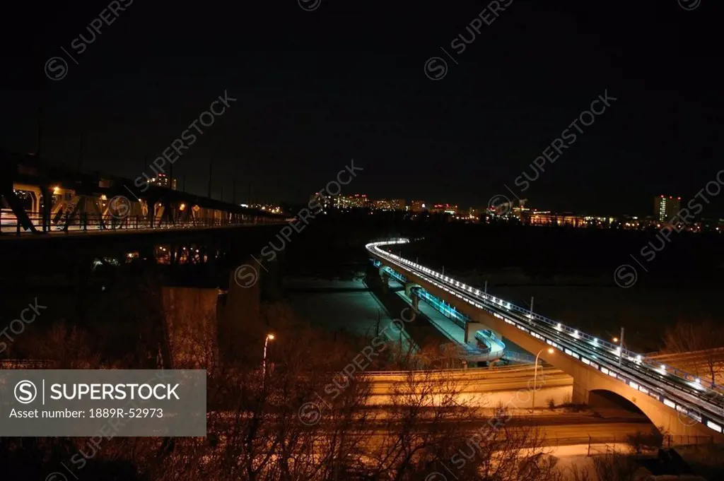 edmonton, alberta, canada, the high level bridge and the lrt bridge going over the north saskatchewan river at night