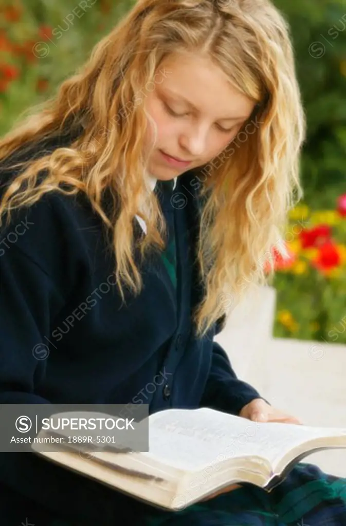 A teenage girl reading