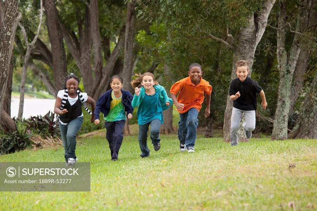 fort lauderdale, florida, united states of america, a group of preteens running to race each other