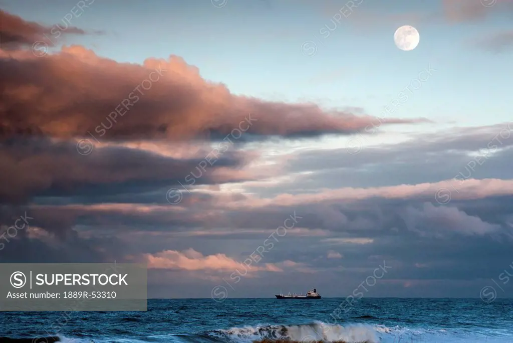 saltburn, teesside, england, a cargo ship out on the ocean