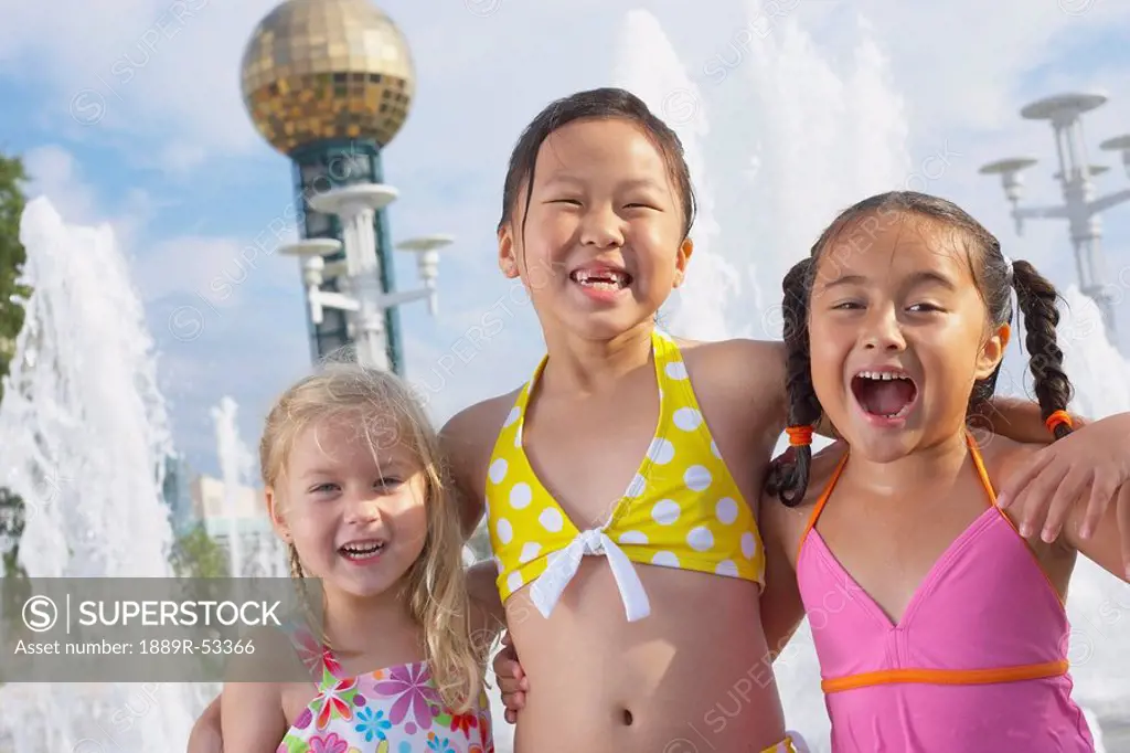 three girls together at a water park