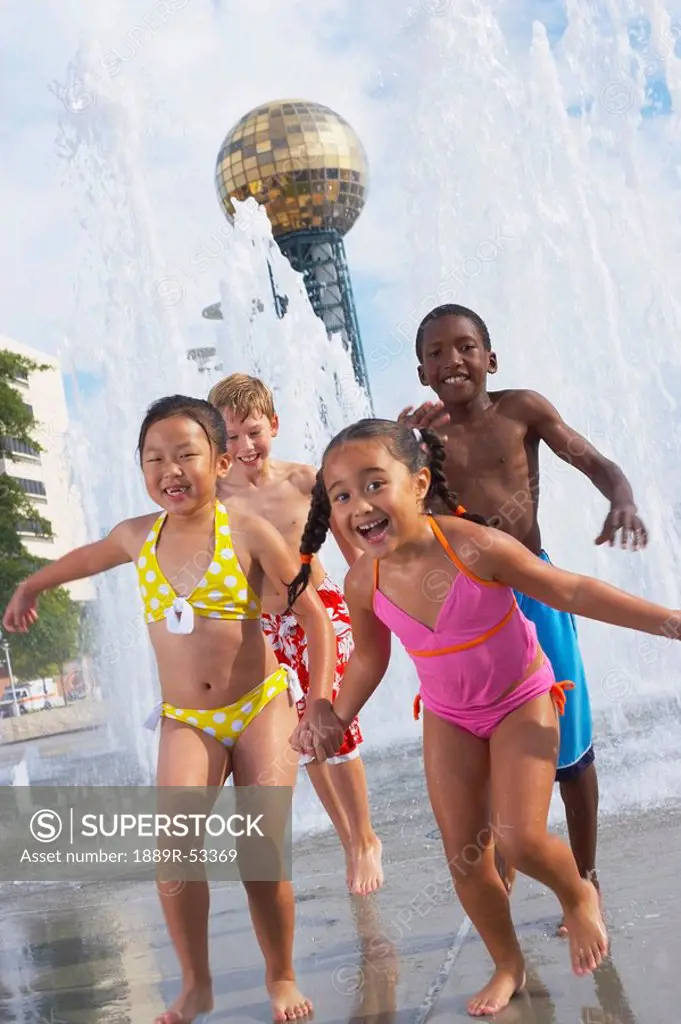 children playing at a water park