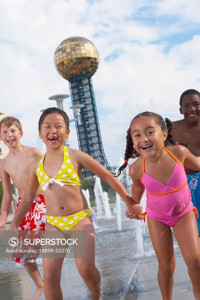 children playing at a water park