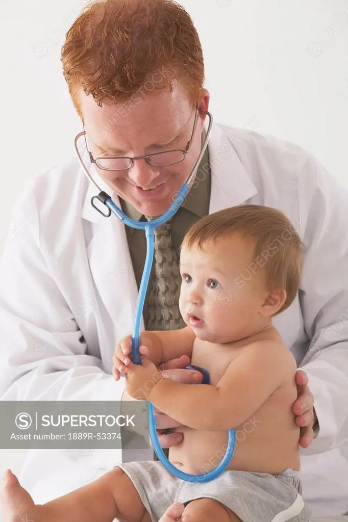 a pediatrician examining a baby