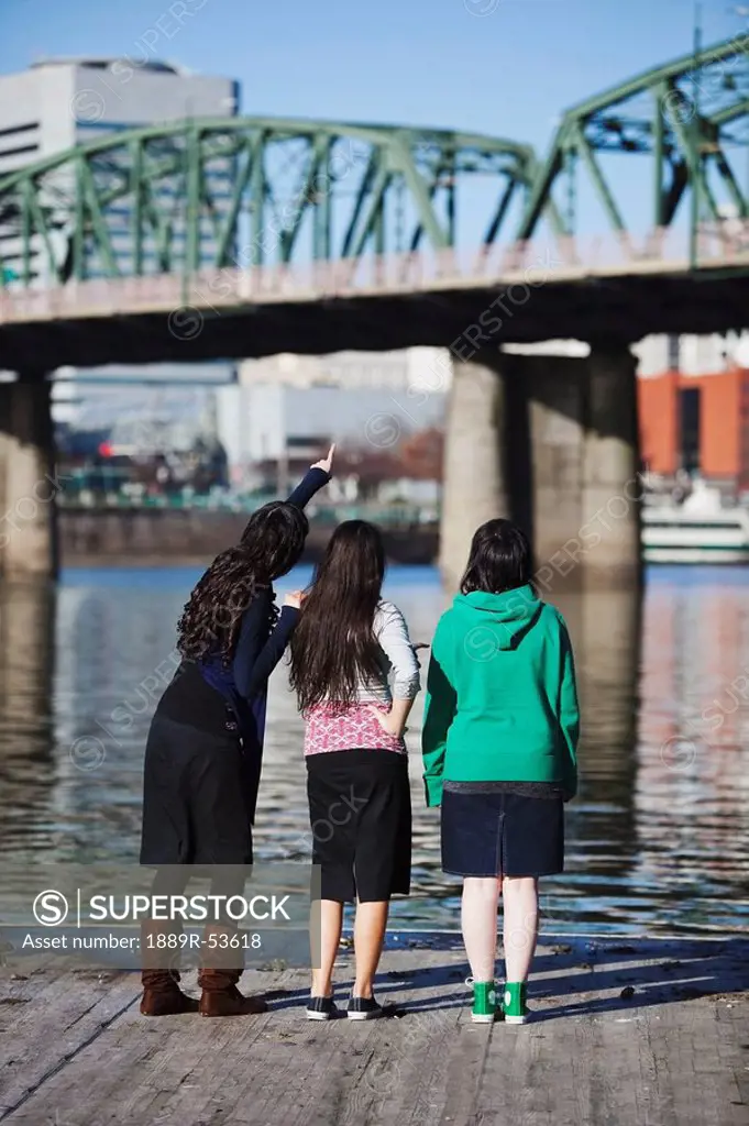 portland, oregon, united state of america, three friends looking at a bridge over a river