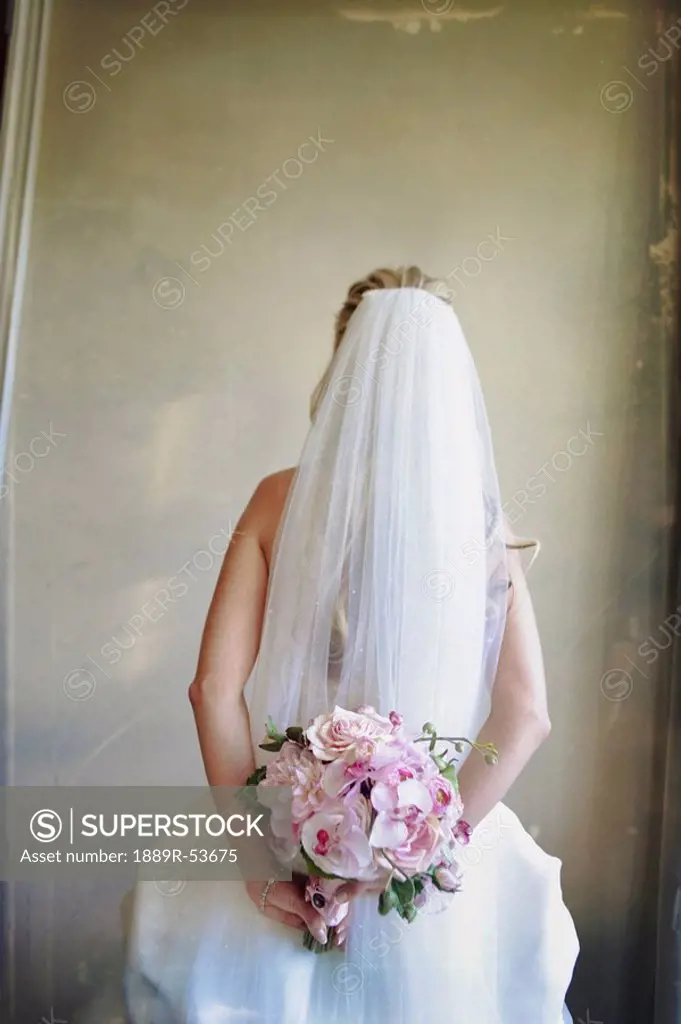 a bride holding her floral bouquet