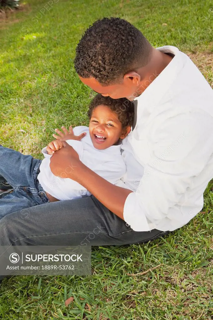 fort lauderdale, florida, united states of america, a father playing with his son