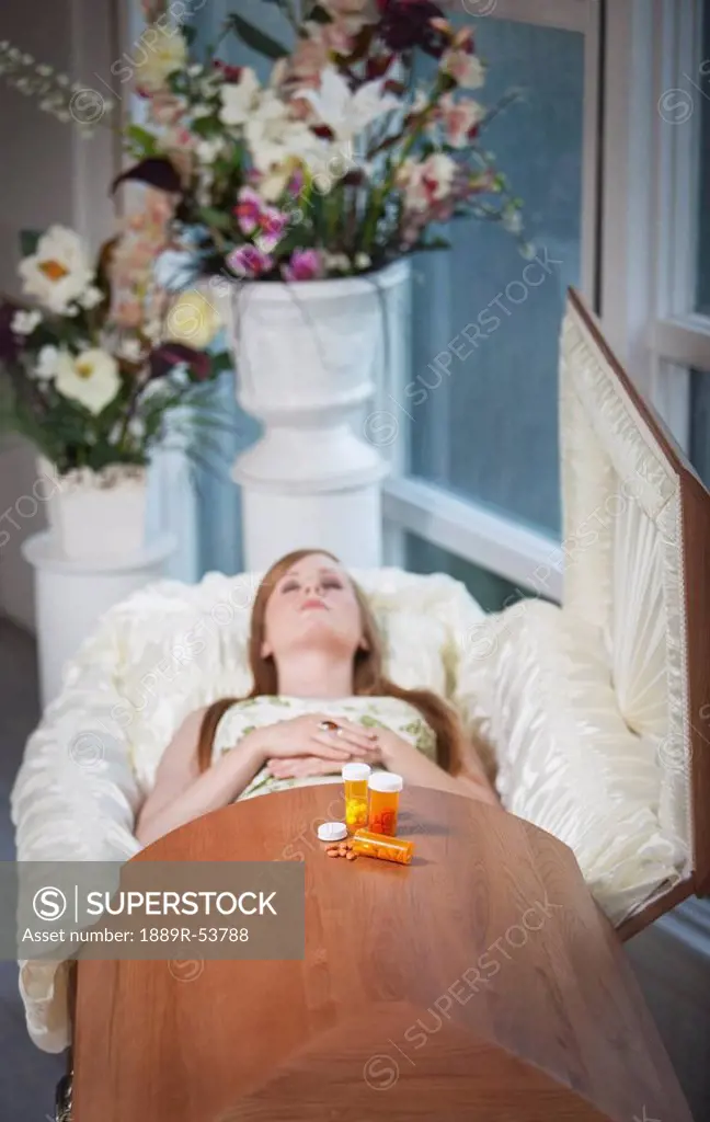 a deceased woman laying in a coffin