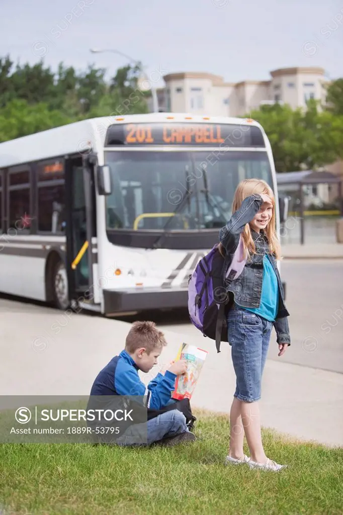st. albert, alberta, canada, two children waiting for the city bus