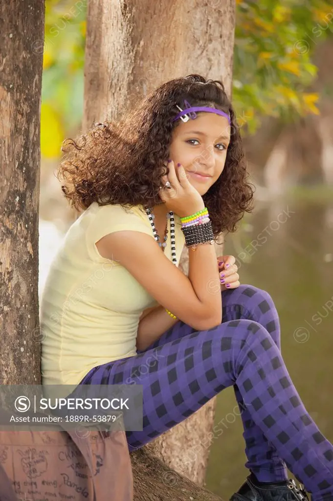 fort lauderdale, florida, united states of america, a girl sitting under a tree