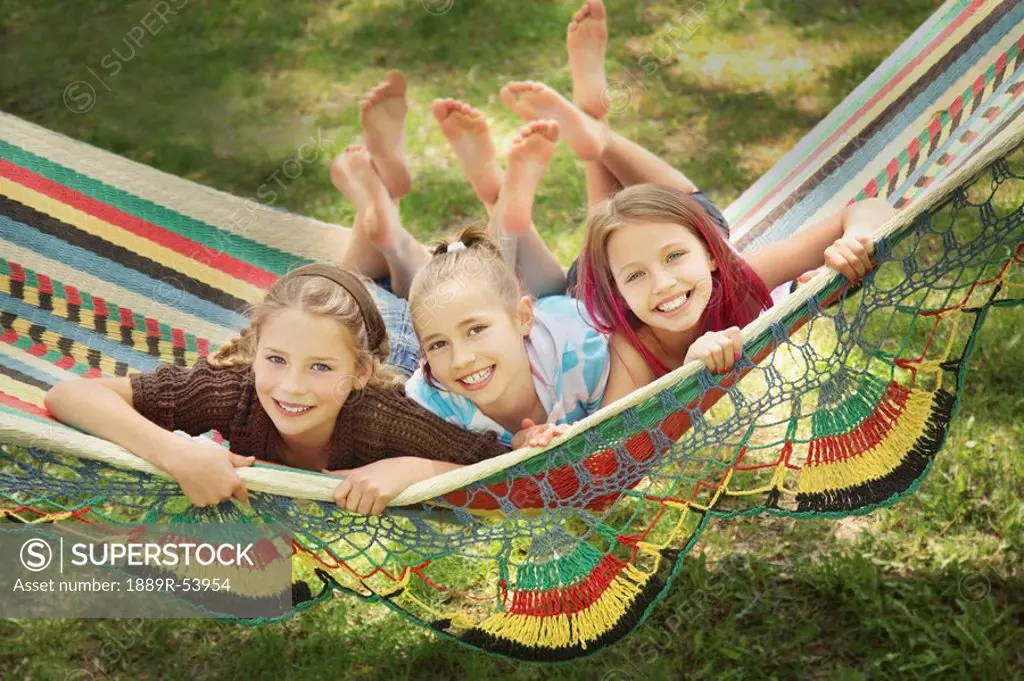 edmonton, alberta, canada, three girls laying in a hammock