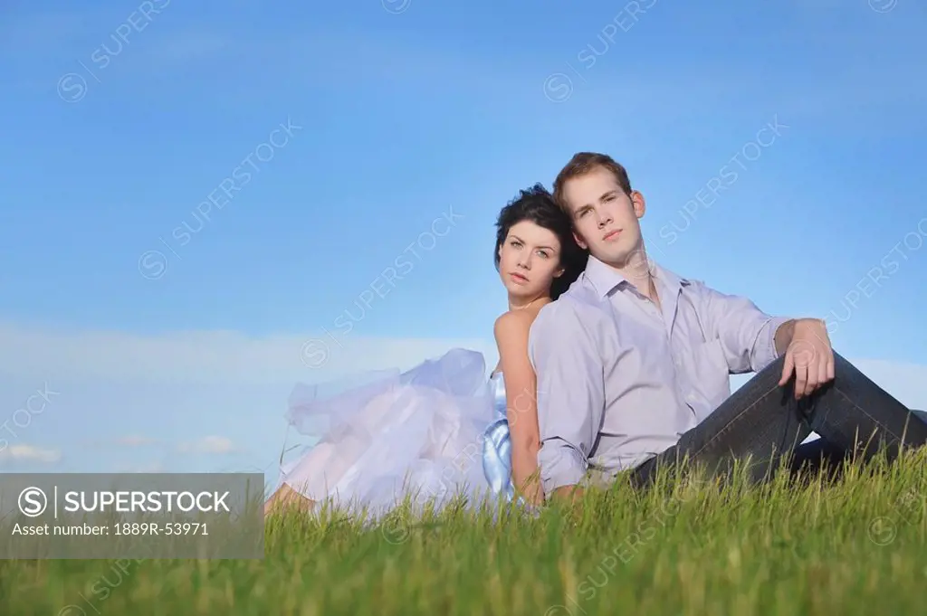 edmonton, alberta, canada, a man and woman sitting on the grass