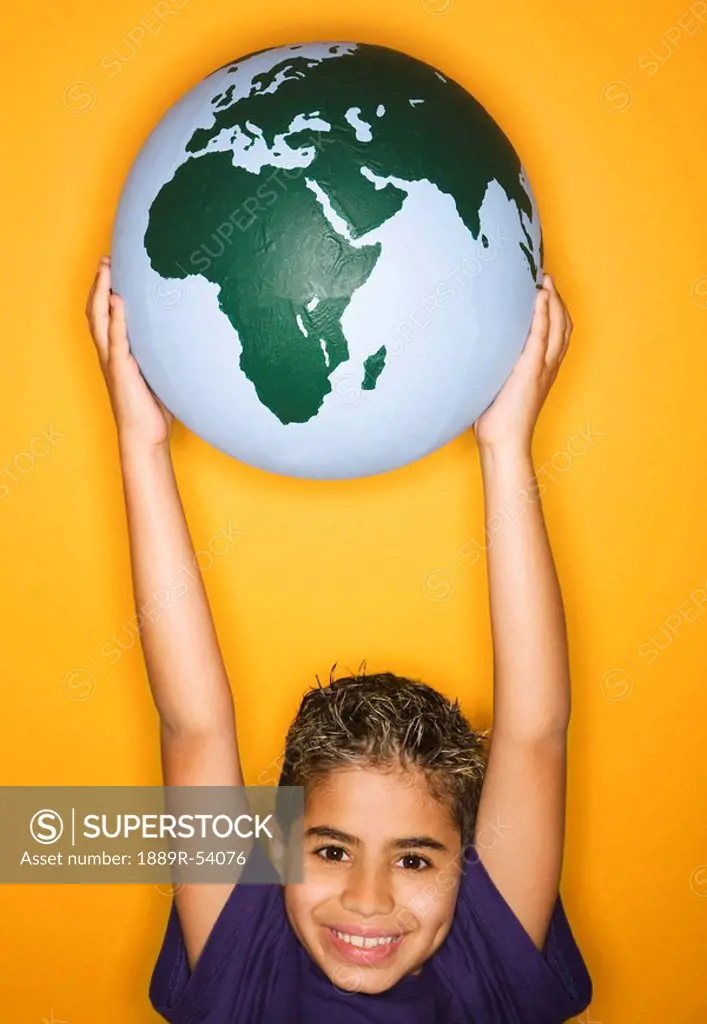 A Boy Holding A Globe
