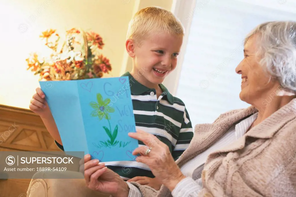 Knoxville, Tennessee, United States Of America, A Boy Gives A Handmade Card To His Grandmother