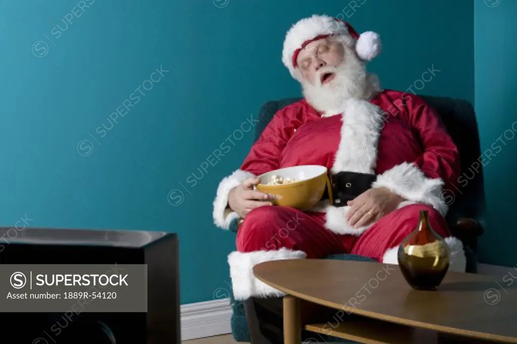 Santa sitting and sleeping