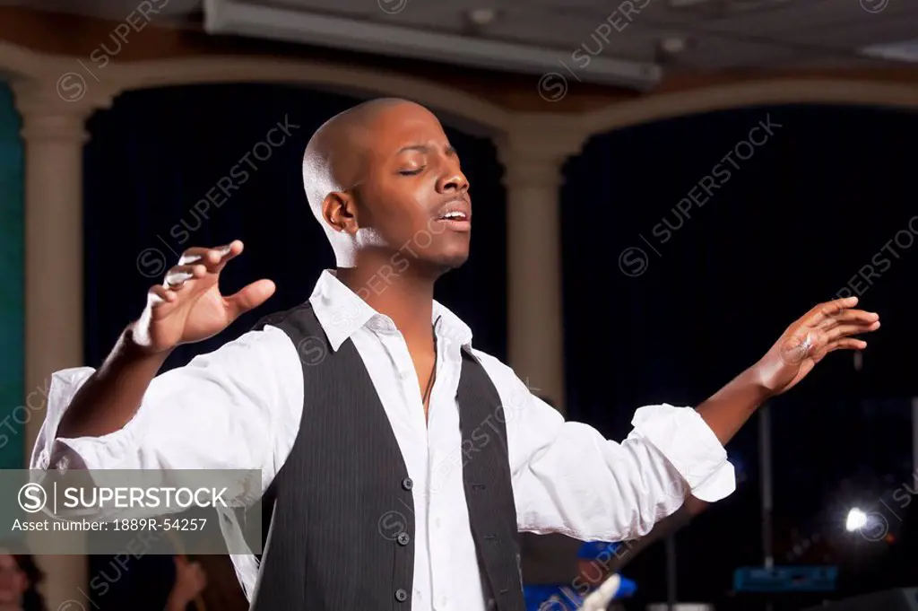 Fort Lauderdale, Florida, United States Of America, A Man With His Hands Raised In Worship