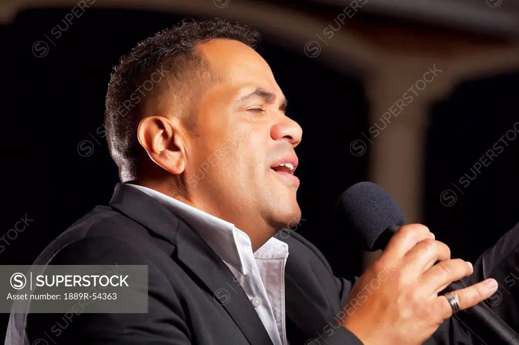Fort Lauderdale, Florida, United States Of America, A Man Singing Into A Microphone And Leading Worship
