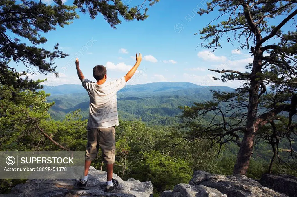Knoxville, Tennessee, United States Of America, A Teenage Boy Stands With Arms Raised While Overlooking The Mountains