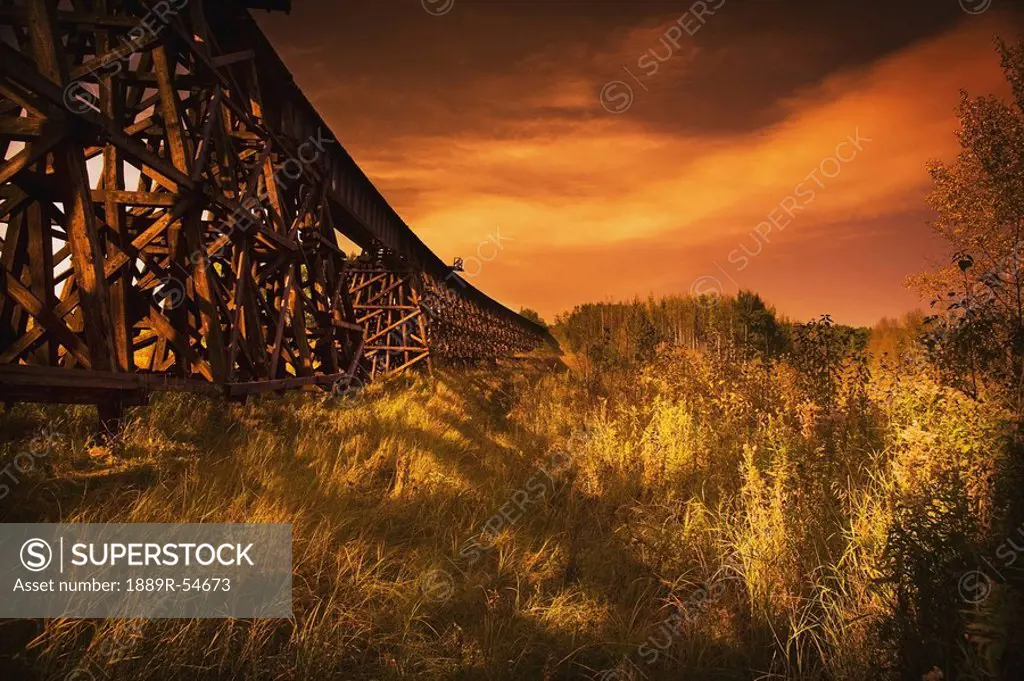 Alberta, Canada, A Train Trestle In A Sunset